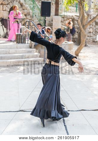 Jerusalem, Israel, September 29, 2018 : Dancer In A Black Authentic Dress Dances To The Music For Vi