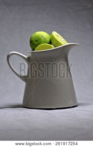 Green Lime In The White Little Mug