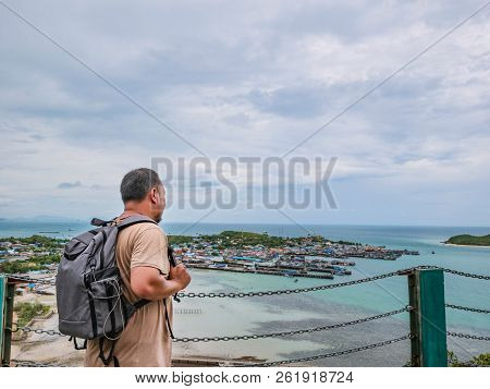 Asisn Fat Backpacker Stand On Top Of  Khao Ma Jor Pier  With Idyllic Ocean Beautiful White Cloud End