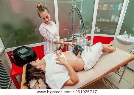 Woman Getting Cryolipolysis Fat Treatment Procedure In Professional Cosmetic Cabinet Or Spa Center