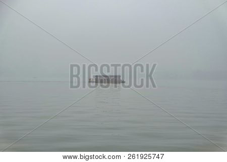One Boat On Scenic Xihu Lake(west Lake) With Foggy Or Mist In Winter Season,hangzhou China