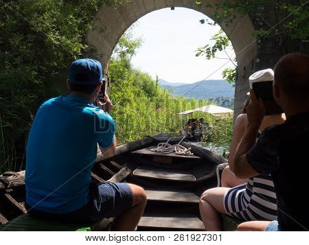 Tourist Enjoying Sailing On Wooden Boat At Beautiful Bacina Lakes - Favourite Summer Holiday Destina