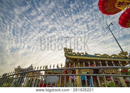 Stanless Fence And Red Chinese Lantern With Golden Dragon On Shrine Roof , Blue Cirrocumulus Cloudy 