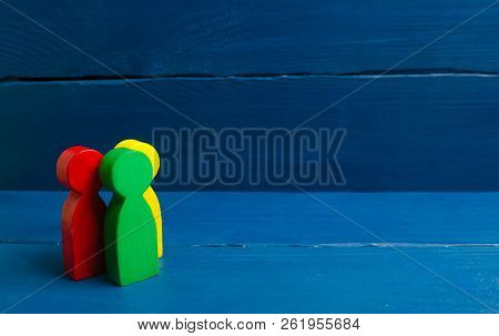 Multicolored People Stand On A Blue Background. The Concept Of Community And Unity. Team, Cooperatio