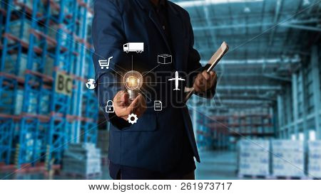Business Logistics Concept, Businessman Manager Touching Icon For Logistics On Modern Trade Warehous