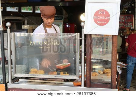 Bangkok, Thailand - April 30, 2018  Michelinstar Symbol On Lebel. This Man Show How To Grill Deep-fr