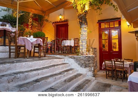 Athens, Greece - September 25, 2018: Taverna In A Street Of Plaka District In Athens, Greece.