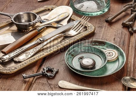 A Photo Of Many Vintage Objects, Flea Market Stuff On A Wooden Background