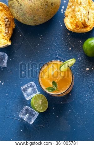 Exotic Fruit Juice From Bel Fruit Or Wooden Apple Called In India Bel Ka Sharbat. Cold Fruit Drink W
