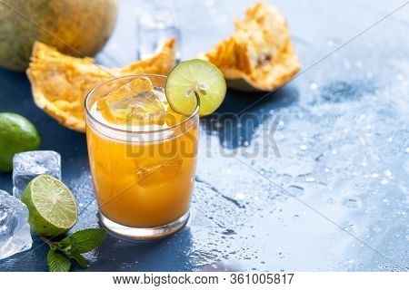 Exotic Fruit Juice From Bel Fruit Or Wooden Apple Called In India Bel Ka Sharbat. Cold Fruit Drink W
