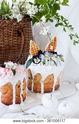 Traditional Easter Sweet Kulich Decorated With Hare Ears And Lilac Flowers Viola Tricolor On A Marbl