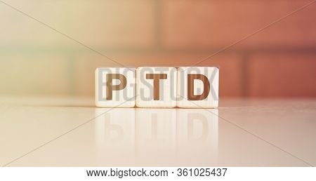 Ptd Acronym Concept. Text On Wooden Cubes With Bright Light