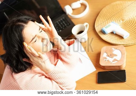 Young Woman Tired Of Work Migraine Stress