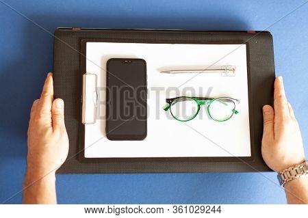 On A Laptop Are Paper Pen Glasses Glasses Smartphone, Mobile Office, Remote Work