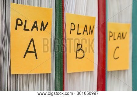 Three Folders With Stickers, On Which Plan A, B Or C Is Written. Business Planning. A Spare Option. 