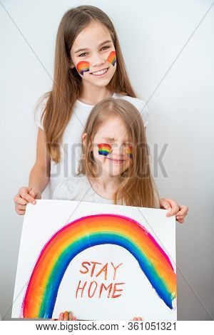 Two Funny Kid Girls With Blond Hair Drew A Rainbow And A Poster Stay Home. Flashmob Chasetherainbow.
