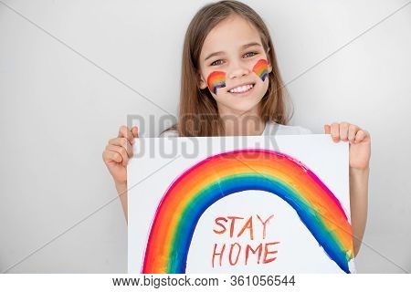 Teen Girl With Blond Hair Drew A Rainbow And A Poster Stay Home. Flashmob Chasetherainbow.