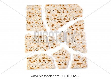 Matzah. Traditional Jewish Easter Bread. Passover Holiday Symbol. Broken Matzo, Lying In A Heap. Iso