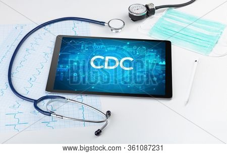 Close-up view of a tablet pc with CDC abbreviation, medical concept