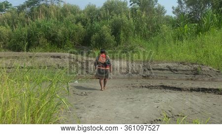 Lago Agrio, Sucumbios / Ecuador - February 20 2020: Back View Of A Barefoot Cofan Indigenous Woman W