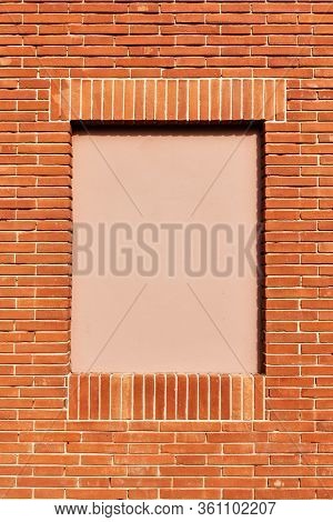 New red brick wall with false window closeup