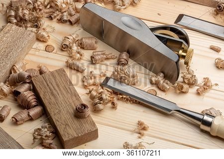 Chisel And Small Block Plane With Wood Shavings