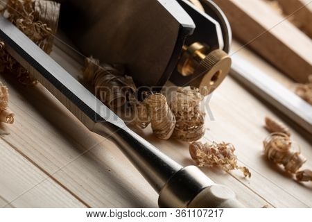 Chisel And Small Block Plane With Wood Shavings