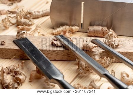 Chisel And Small Block Plane With Wood Shavings