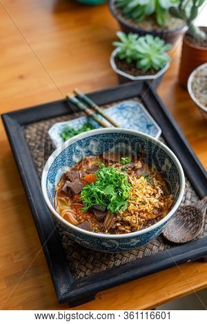 Rice Noodles With Spicy Pork Sauce (nam Ngiao) On Black Table, Thai Food.