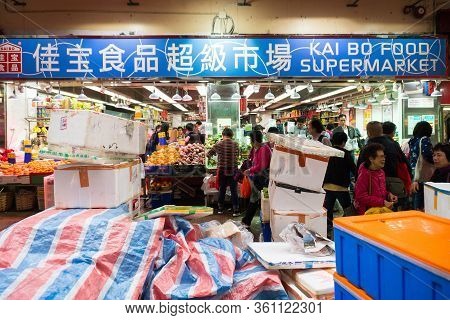 Hong Kong,march 24,2019:people Among The Classic Markets In The Narrow And Crowded Streets Of Hong K