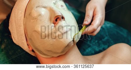 Alginate Mask Applied On The Face Of Caucasian Woman At The Spa Salon While Lying