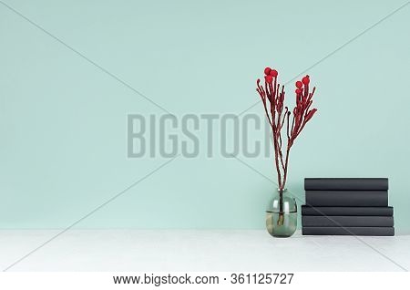 Modern Elegant Home Workplace With Black Books, Glass Vase With Red Branch In Green Mint Menthe Inte