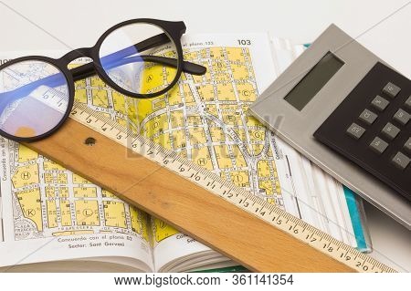 Guide, Plan, Book With The Street Map Of A City