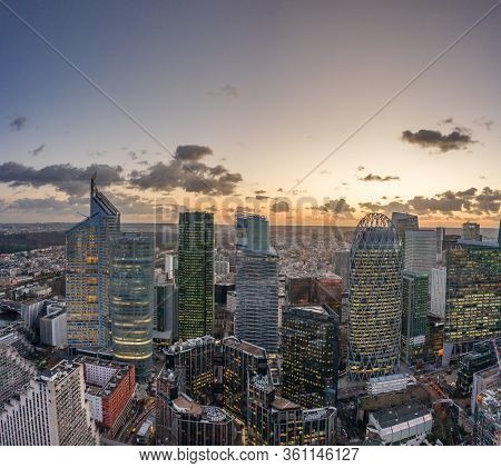 Paris, France - December 09, 2019: Aerial Drone Shot Of Buring Clouds During Sunset From View Of La 
