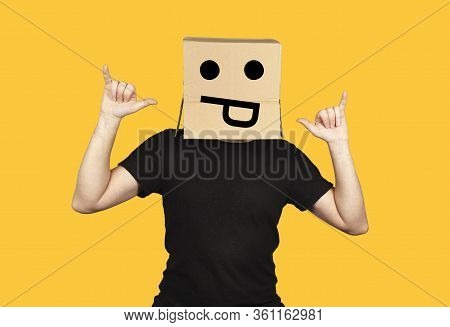 Funny Man With Box On His Head And Emoji Having Fun. Crazy Rock And Roll Party And Celebration.