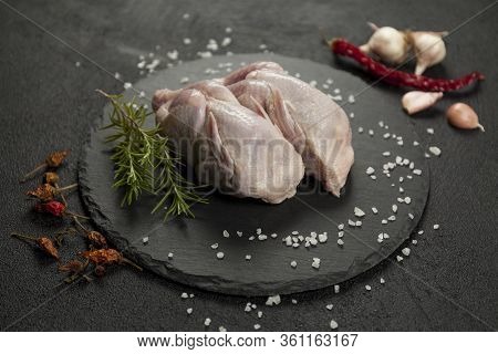 Raw Quail Meat On Kitchen, Cooking Gourmet Bird. Healthy Diet Recipe.