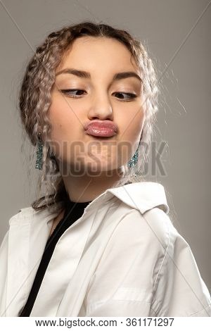 Fun Pretty Girl On Gray Background Making Duckface