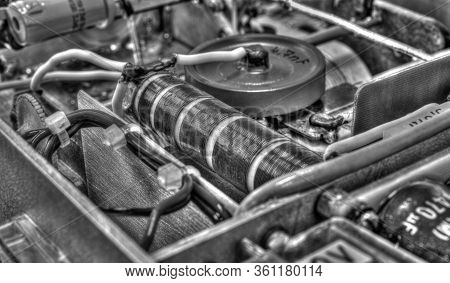 Inside View Of High Frequency Power Amplifier With Capacitors, Coils And Other Components In Black A