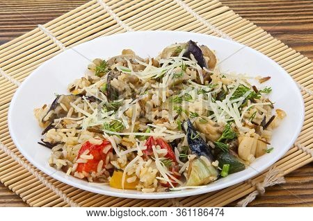 Stewed Vegetables With Rice On A Plate On A Wooden Background