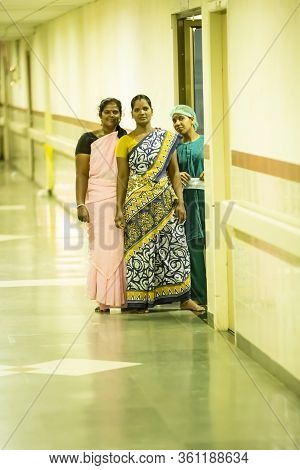 Puducherry, India - March Circa, 2020. Tree Indian Women Waiting In The Corridor Of Hospital Without