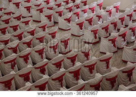 Top Angle View Of Backside Of Chairs, Which Are Arranged In Rows Looks Like Pattern. The Chairs Are 