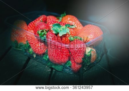 Strawberries In The Basket. Strawberries On The Table. Summer Strawberries In The Garden. Berries In