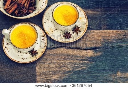 Hot Curcuma Turmeric Milk Drink With Spices. Vintage Style Toned Picture