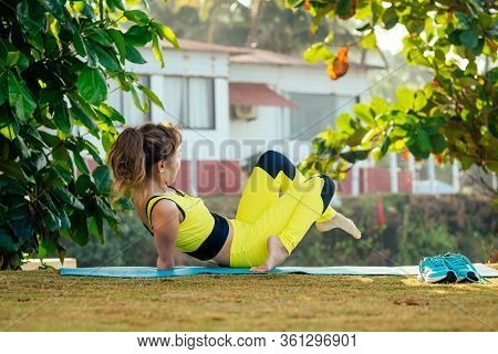 Happy Asian Armless Woman Warming Up Before Swimming At The Tropical Beach