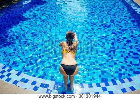 Beautiful Young Armless Woman Training To Swim In Pool At Tropical Resort