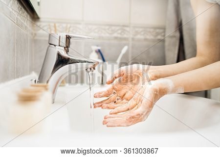 Woman Washing Hands With Soap And Water In Clean Bathroom.decontamination Protocol,hand Hygiene Rout