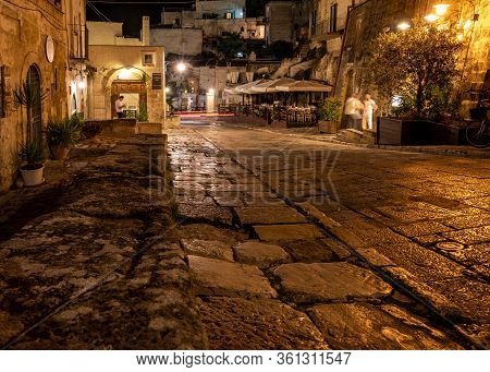Matera, Italy - September 19, 2019: Evening View Of The City Of Matera, Italy, With The Colorful Lig