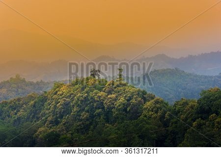 Tropical Forest With Mountains And Majestic Orange Sky And Clouds. Camping Site At Maewong National 