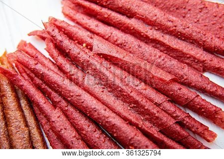 Sweet Pureed Fruit Pastille. Fruit Roll-ups Homemade. Natural Sweets From Dried Berries And Fruits.