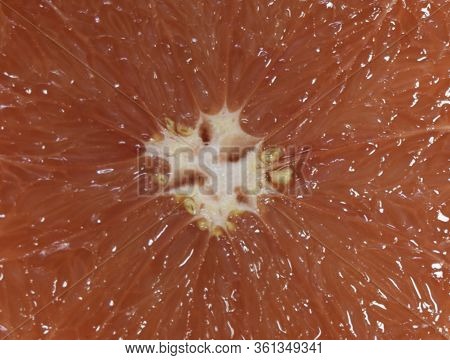 Texture Of Grapefruit Slice, Close-up, Citrus Backgrounds. Macro Of Red Grapefruit. Fresh Grapefruit